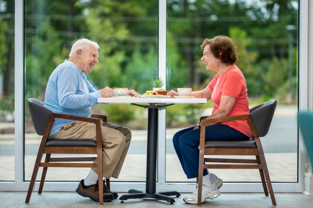 couple sitting at dining table 