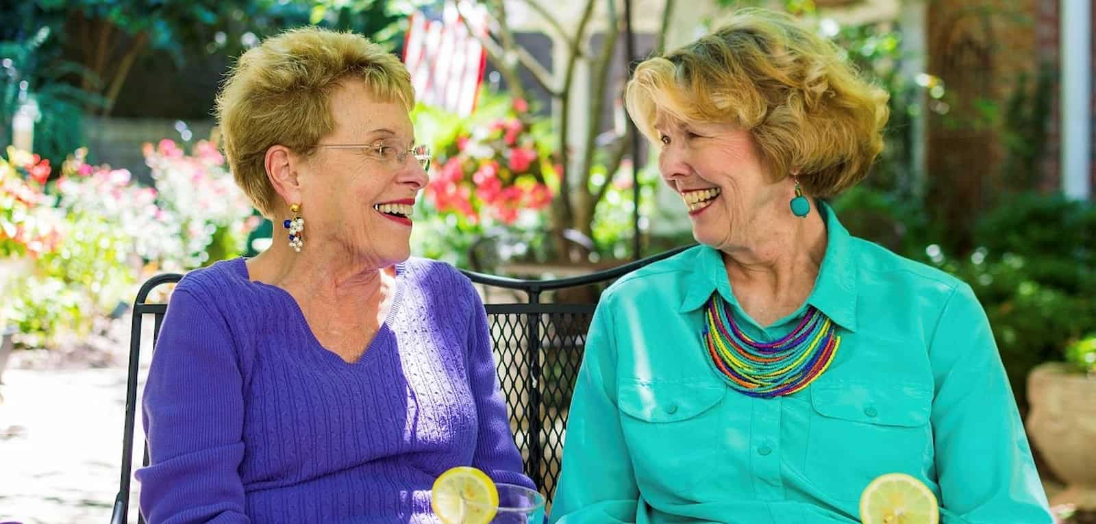 Ladies smiling on bench